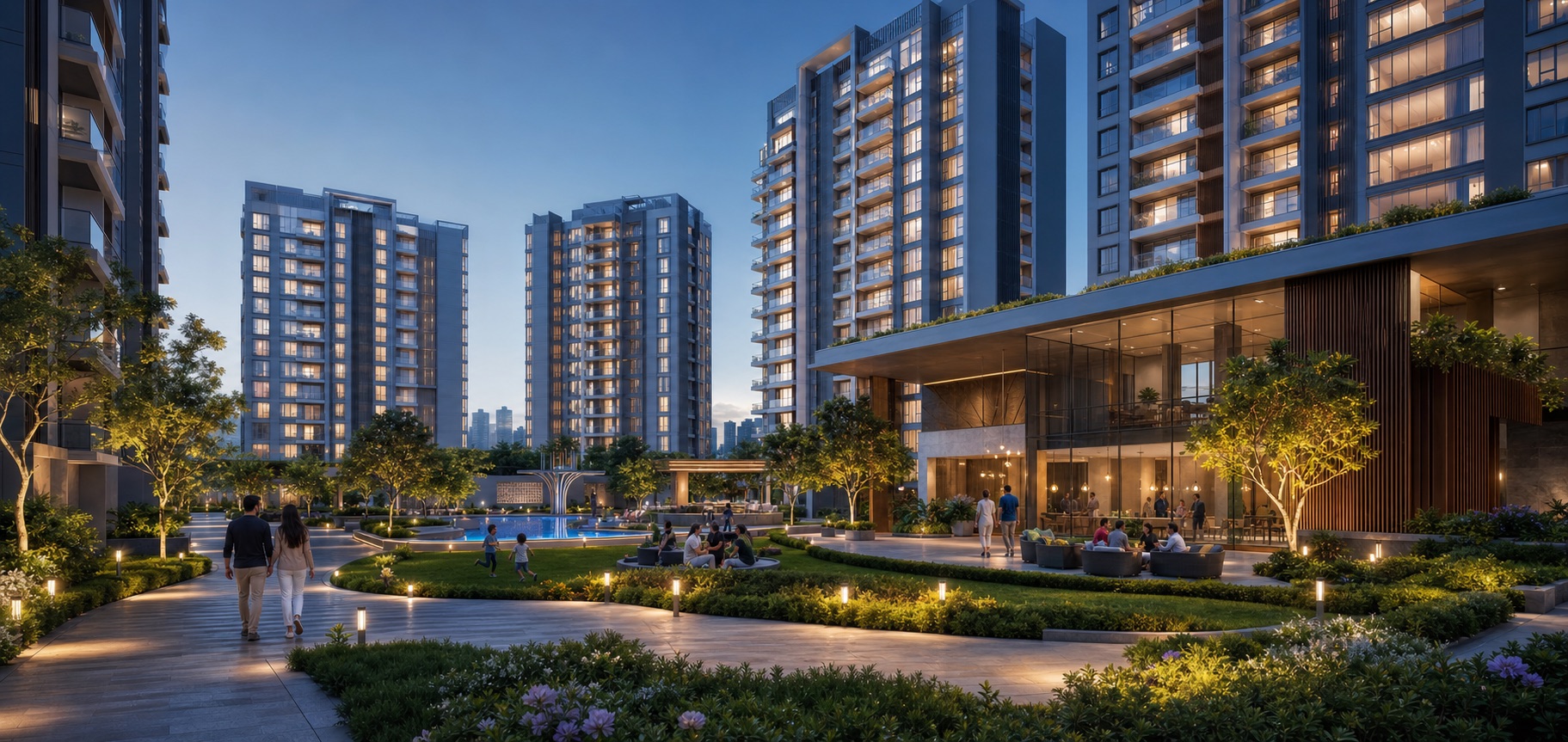 Premium residential community with towers, landscaped podium, and clubhouse lighting