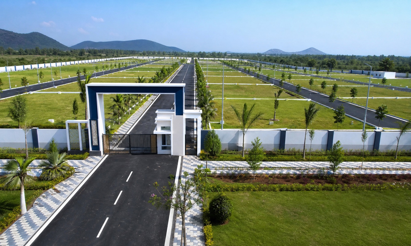 Premium open plot layout with wide roads, landscaped entry, and plotted development infrastructure